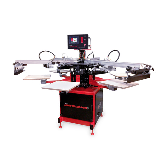 Lawson Workhorse Group (LWG) Mini-Trooper automatic screen printing press with a red and black base, featuring a 6-station carousel, silver print heads, and an integrated digital control touch screen.