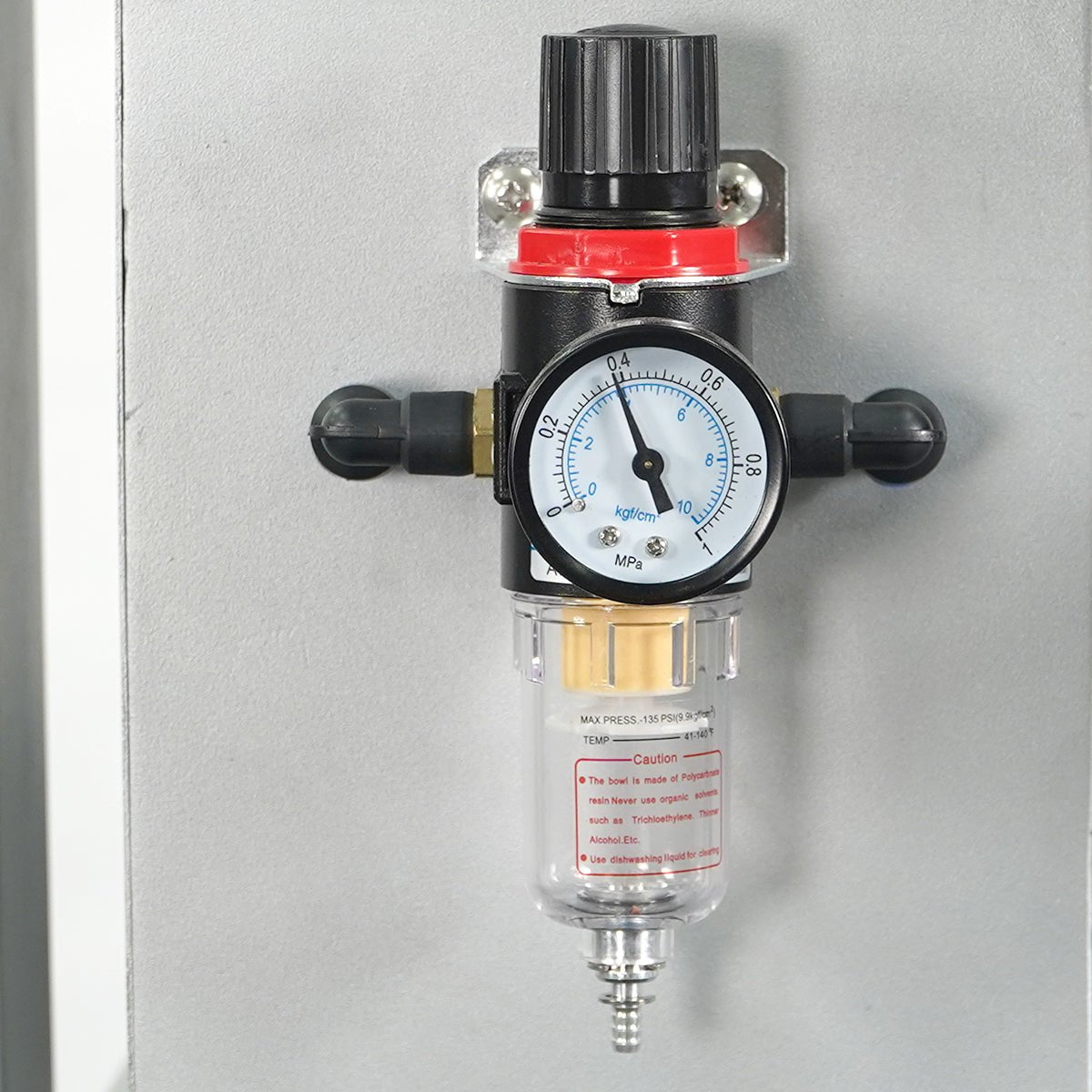 Pressure regulator with gauge on a gray background