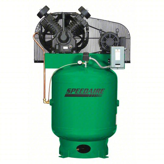 A green Speedaire industrial air compressor with a black fan assembly, protective guard, copper piping, and an electrical control box, shown against a plain white background.