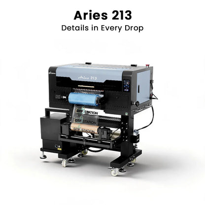 A large industrial DTF (Direct to Fabric) printer labeled 'Aries 213' with the text 'Details in Every Drop' above it, shown on a clean white background. The printer has a black and light gray body with a blue spool of material in the print bed.