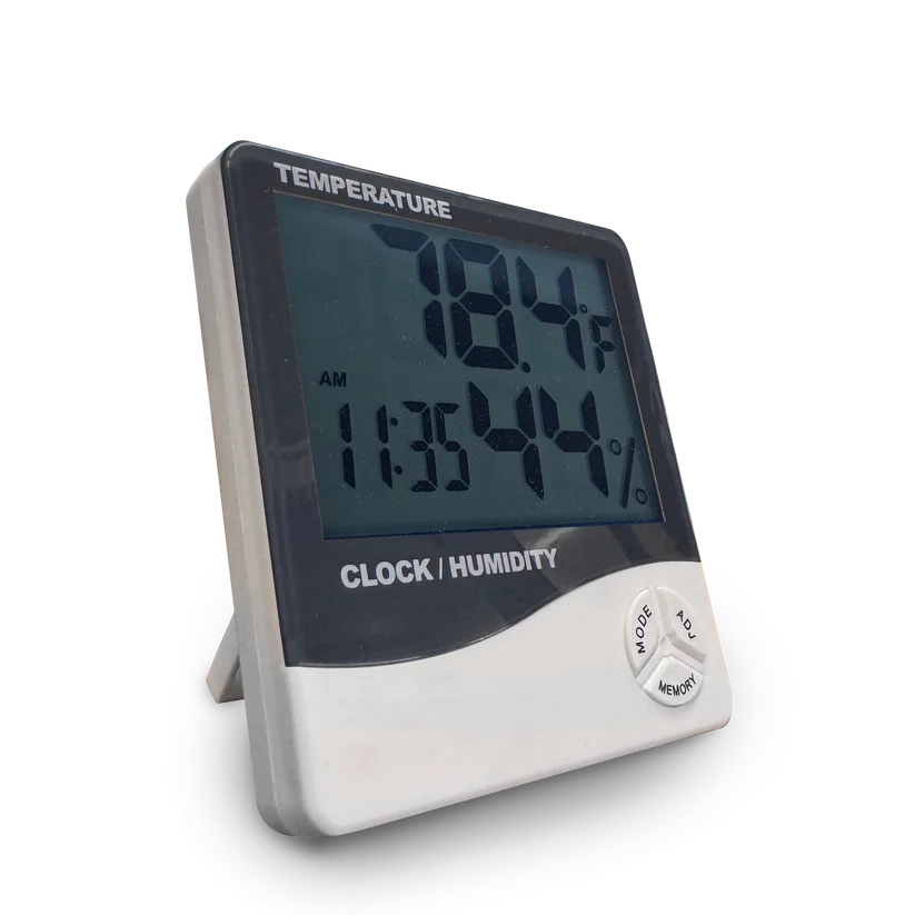 Digital temperature and humidity clock with a black LCD screen and white plastic body, shown on a clean white background.