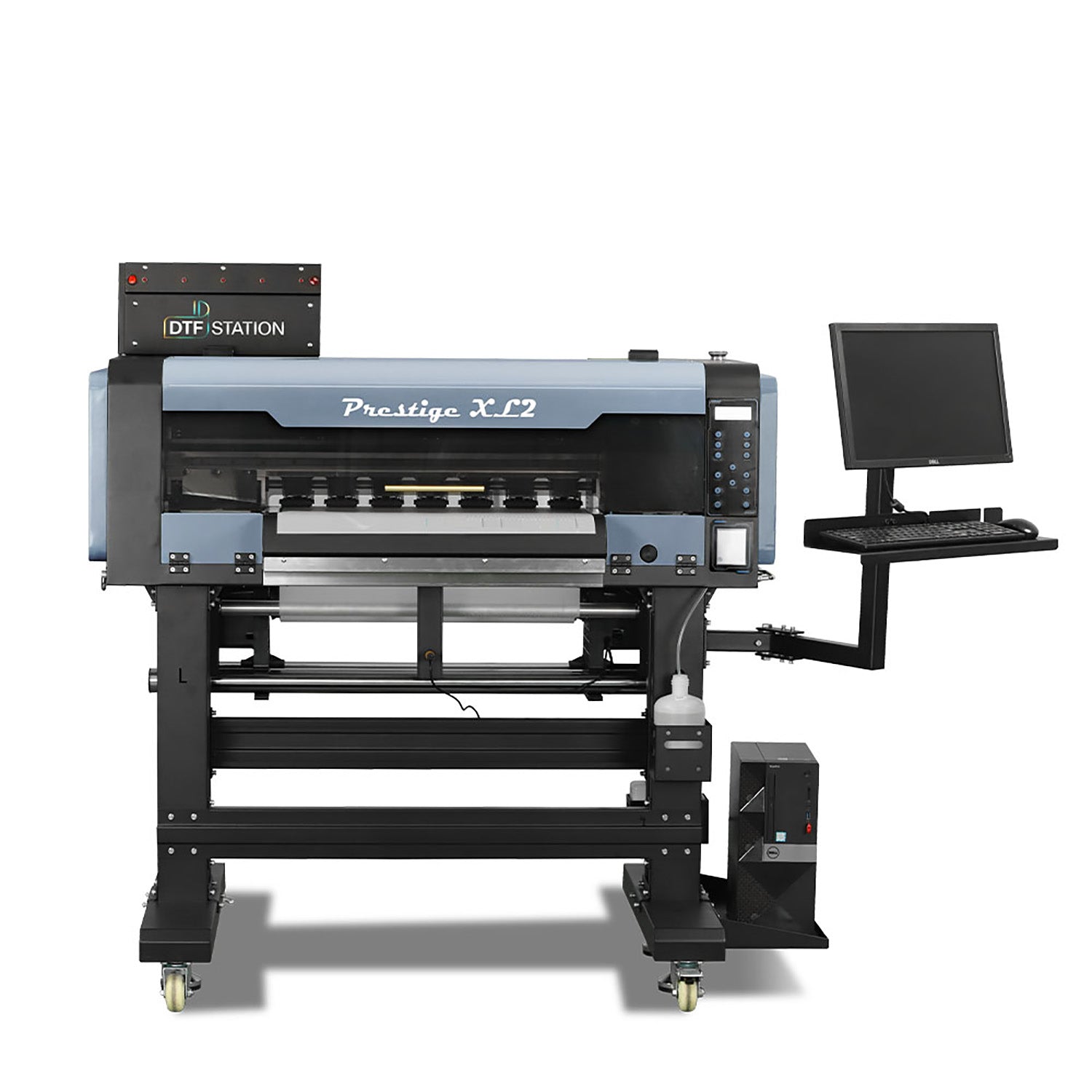 Front-facing view of the Prestige XL2 24" production roll-to-roll DTF printer, featuring an integrated workstation with a monitor mount and dual Epson i3200 printheads.