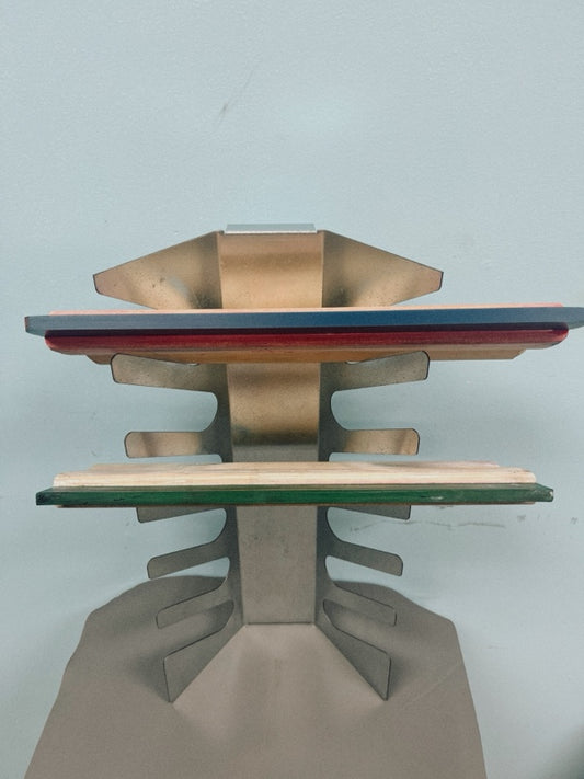 Wall-mounted aluminum squeegee rack holding six screen printing squeegees.