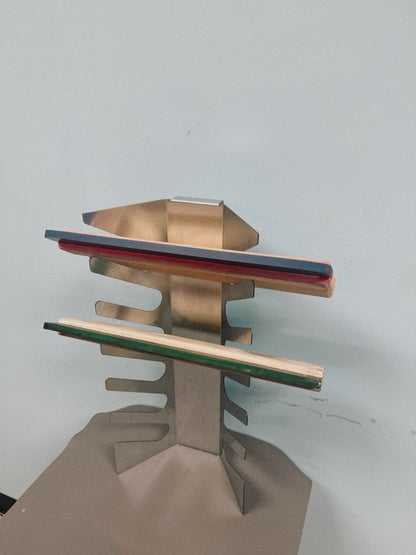 Wall-mounted aluminum squeegee rack holding six screen printing squeegees.