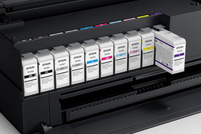 A row of Epson UltraChrome PRO10 ink cartridges installed inside the ink bay of a black Epson SureColor P900 printer.