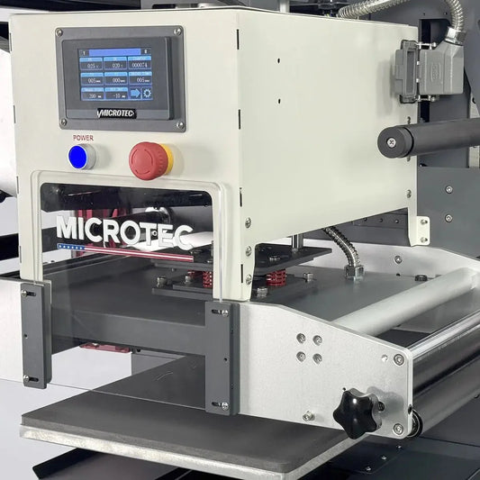 MICROTEC machine with a digital display and control buttons on a white background