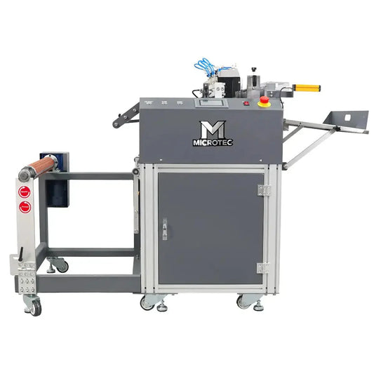 Industrial machine with 'Microtec' branding on a white background
