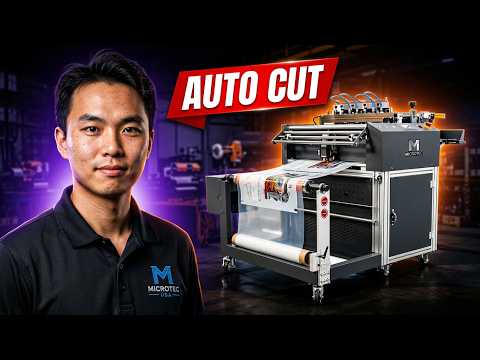 Microtec USA presenter next to the Microtec XC-25 automatic roll-to-sheet cutter machine processing DTF transfer film with red "AUTO CUT" banner text