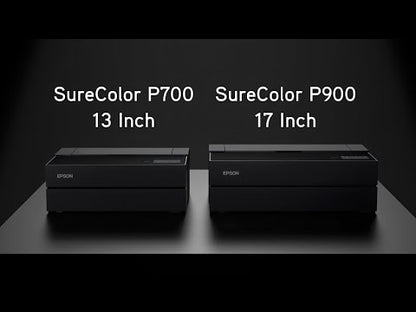 Two Epson desktop photo printers side-by-side on a dark surface: the SureColor P700 (13 Inch) on the left and the SureColor P900 (17 Inch) on the right, shown against a dark, minimalist background.
